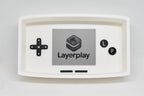 Catchall Studio BitTray H1 3D‑printed tray displayed on a white background with its console‑style screen and button layout.