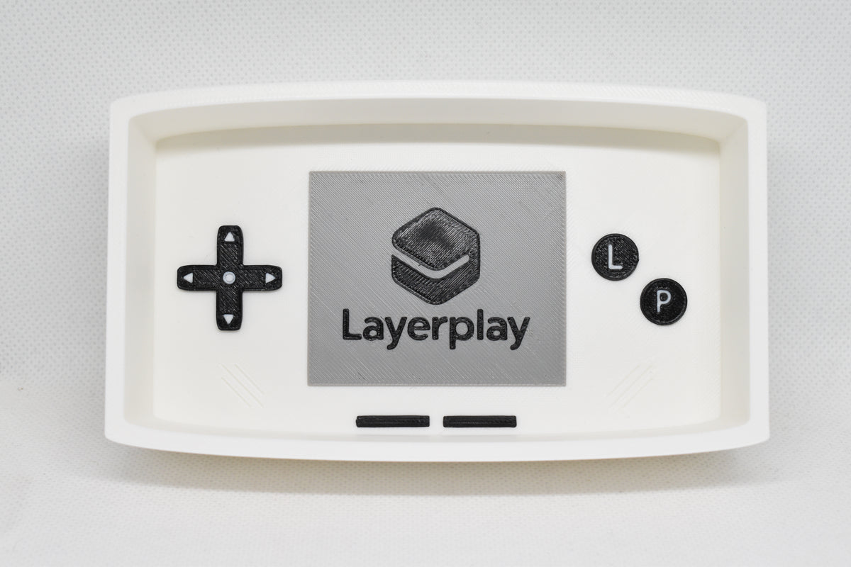 Catchall Studio BitTray H1 3D‑printed tray displayed on a white background with its console‑style screen and button layout.