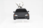 Black EG Civic keychain displayed on a white stand with metal ring and clip.