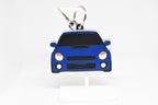 Blue Bugeye WRX keychain displayed on a white stand with metal ring and clip.