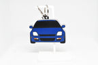 Blue Prelude keychain displayed on a white stand with metal ring and clip.