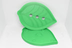 Solara Series FloraDrain Soap Dish shown in two pieces: a leaf‑shaped top with drainage holes and a matching base with alignment points, both 3D‑printed and displayed on a white background.