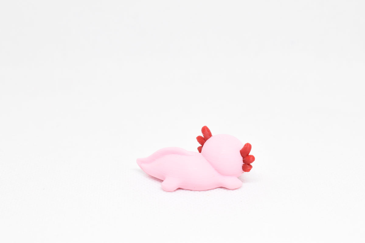 Side angle perspective showing smooth 3D layers and thickness of kawaii axolotl desk accessory figurine by LayerPlay