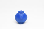 Rear view showing smooth 3D layers and top leaf crown structure of blue kawaii blueberry desk toy figure by LayerPlay