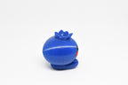 Side profile view showing round blue body and top crown detail of 3D printed kawaii blueberry desk toy by LayerPlay