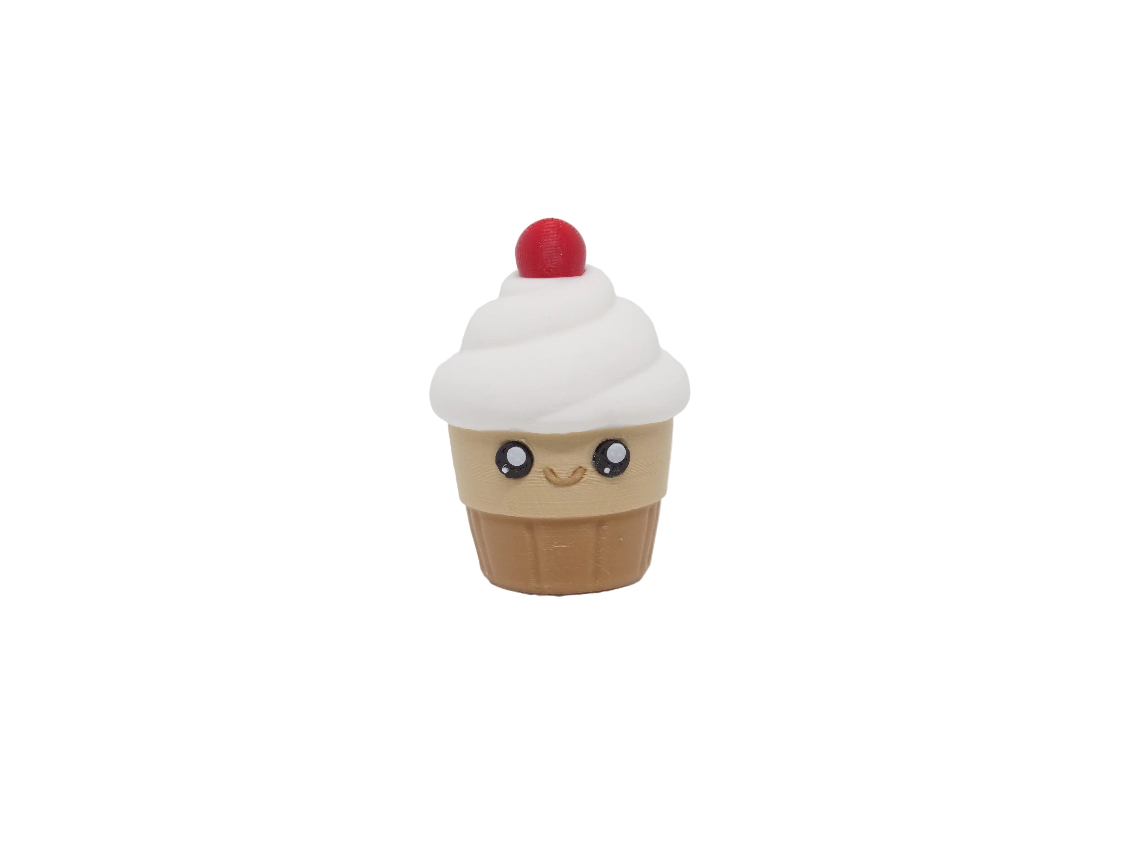 Kawaii Cupcake 3D‑printed desk toy on a white background featuring a cute smiling cupcake with swirled frosting and rosy cheeks.