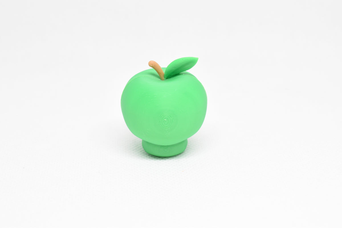 Rear view showing top leaf texture and smooth finish of green kawaii green apple desk toy figure by LayerPlay