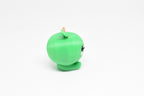 Side profile view showing round green body and leaf stem detail of 3D printed kawaii green apple desk toy by LayerPlay