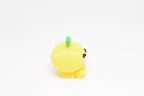 Side profile view showing round yellow body and green leaf detail of 3D printed kawaii lemon desk toy by LayerPlay