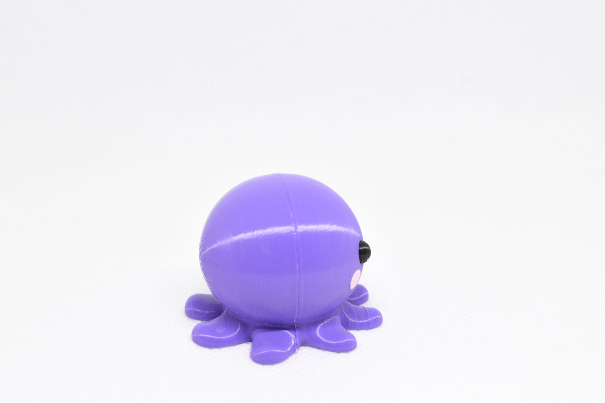 Side angle perspective showing smooth 3D layers and thickness of kawaii octopus desk accessory figurine by LayerPlay