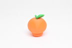 Rear view showing top green leaf texture and smooth finish of orange kawaii orange desk toy figure by LayerPlay