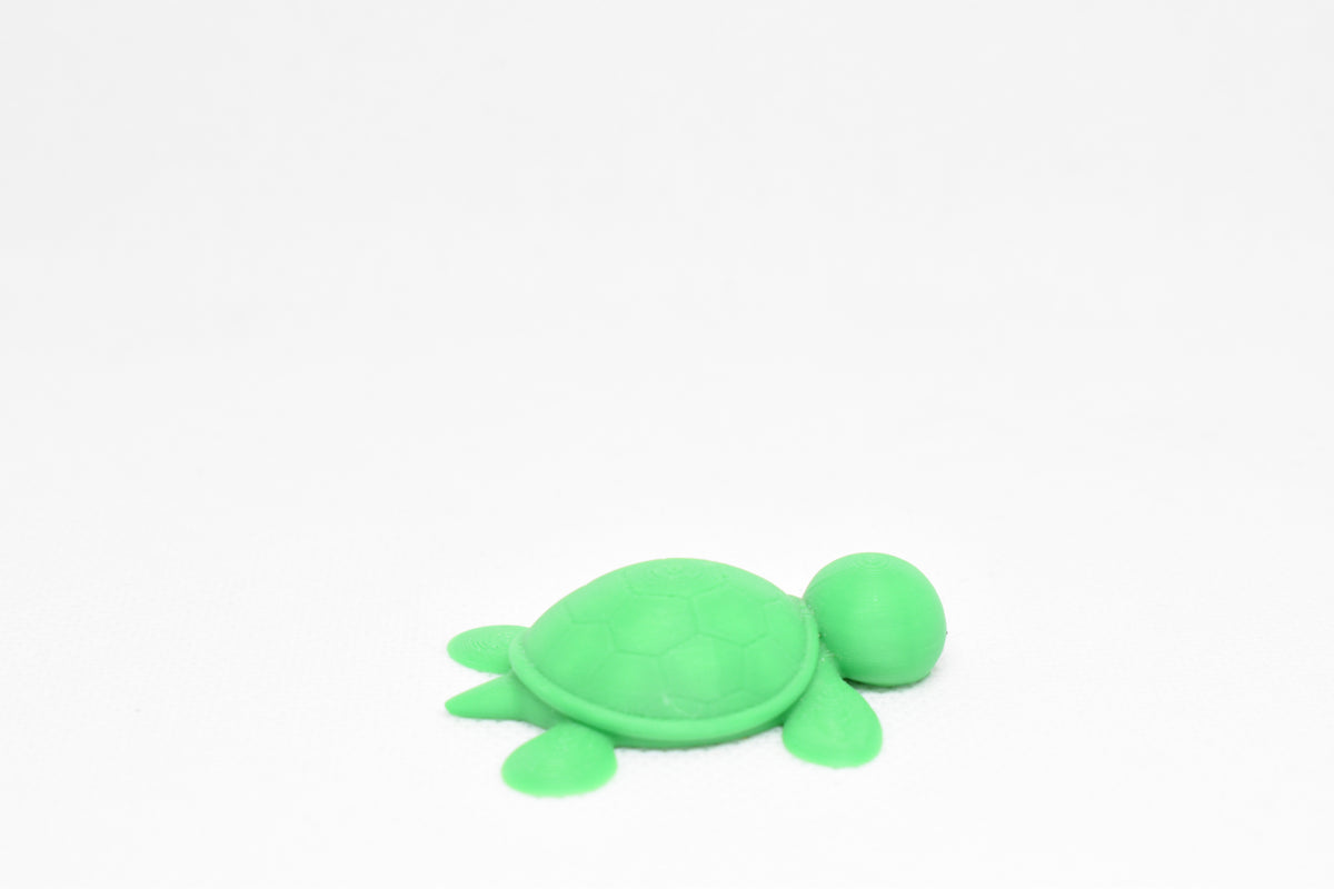 Side angle perspective showing smooth 3D layers and thickness of kawaii sea turtle desk accessory figurine by LayerPlay