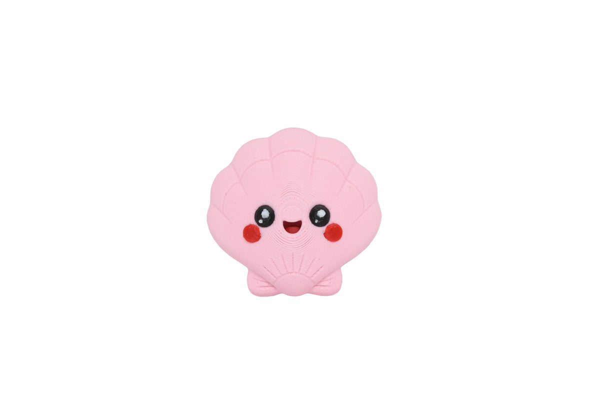 3D printed kawaii seashell desk toy figure with rosy cheeks and smiling face front view by LayerPlay