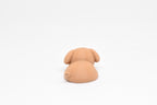 Rear view showing back body curves and tail detail of brown kawaii sleeping dog desk toy figure by LayerPlay