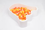 Angled top view of 3D printed white ghost candy dish filled with candy corn for Halloween decor by LayerPlay Layertreat