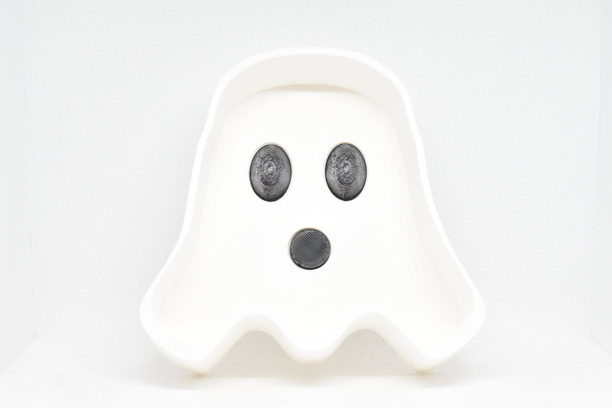 Front studio view showing 3D printed white ghost silhouette with black eyes and mouth of BooBowl candy dish by LayerPlay Layertreat