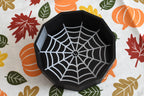 3D printed black spider web candy dish displayed on a fall patterned tablecloth with leaf and pumpkin print by LayerPlay Layertreat