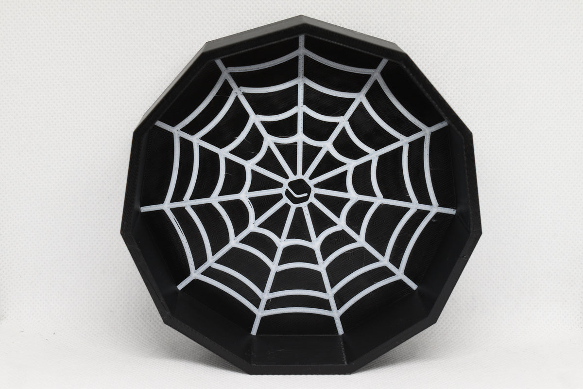 Top studio view of 3D printed black octagonal CobBowl candy dish featuring white spider web inlay design by LayerPlay Layertreat
