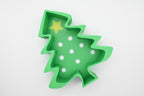 Top-down flat lay of the Layertreat FestiveTree 3D printed green Christmas tree candy dish featuring a yellow star topper and white polka dot accents on a clean white background.
