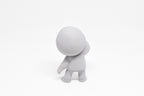 Rear view showing hooded sweatshirt detail and leaning pose of grey 3D printed monomoodz drift collectible figure by LayerPlay
