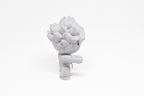 Side profile view showing extended fist stance and layered spiked hair of 3D printed monomoodz erix desk figure by LayerPlay