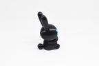 Side profile view showing black body, tall rabbit ears, and glow in the dark blue eye detail of 3D printed monomoodz nixie desk figure by LayerPlay