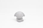 Rear view showing floppy dog ears and tail profile of grey 3D printed monomoodz glyphie collectible figure by LayerPlay