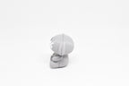 Side profile view showing floppy ear and white X eye detail of 3D printed monomoodz glyphie dog desk figure by LayerPlay