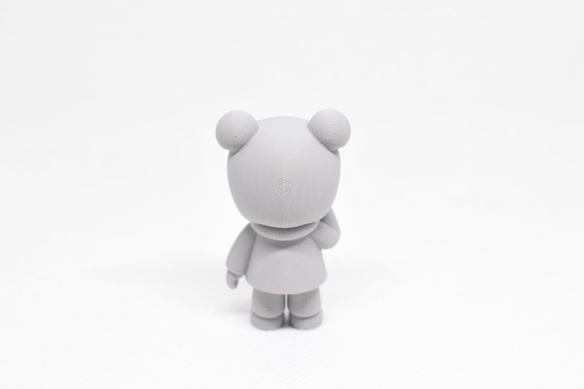 Rear view showing bun hair detail and hoodie hood of grey 3D printed monomoodz kiri collectible figure by LayerPlay