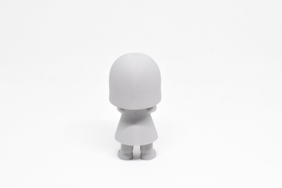 Rear view showing straight bob hair texture and dress profile of grey 3D printed monomoodz luma collectible figure by LayerPlay