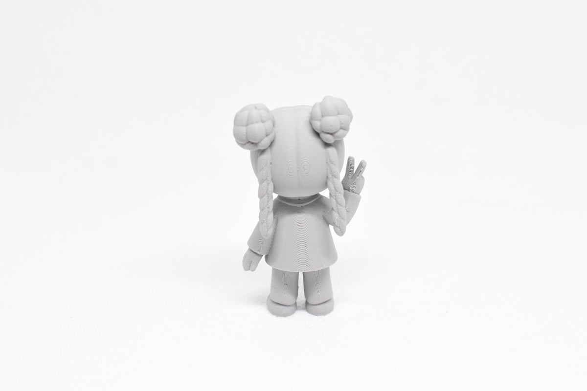 Rear view showing textured double bun hairstyle and long braids of grey 3D printed monomoodz lunella collectible figure by LayerPlay