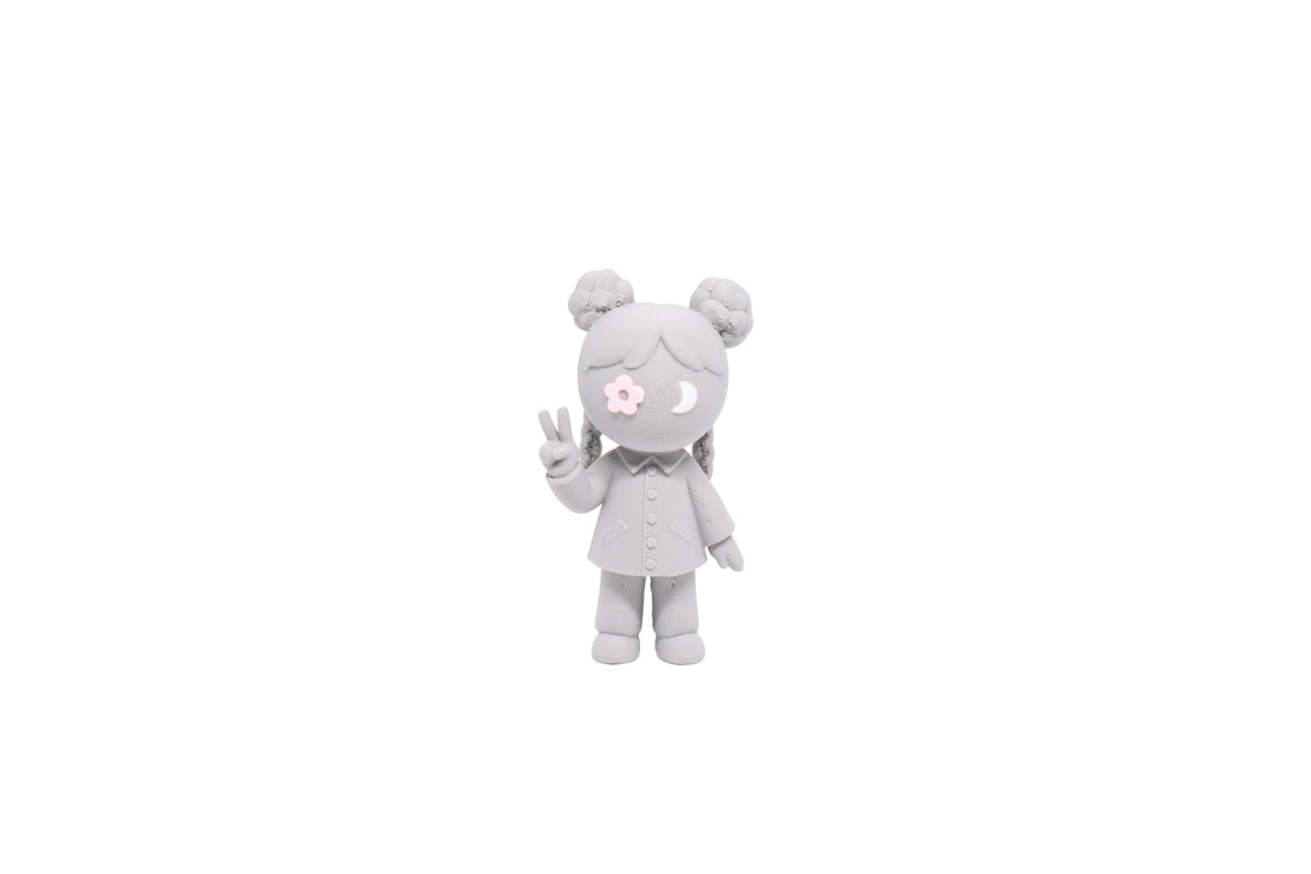 3D printed grey monomoodz lunella desk figure with pink flower eye, crescent moon eye, space buns, and peace sign front view by LayerPlay