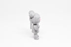 Side profile view showing braided hair pigtails, space bun hairstyle, and peace hand pose of 3D printed monomoodz lunella desk figure by LayerPlay