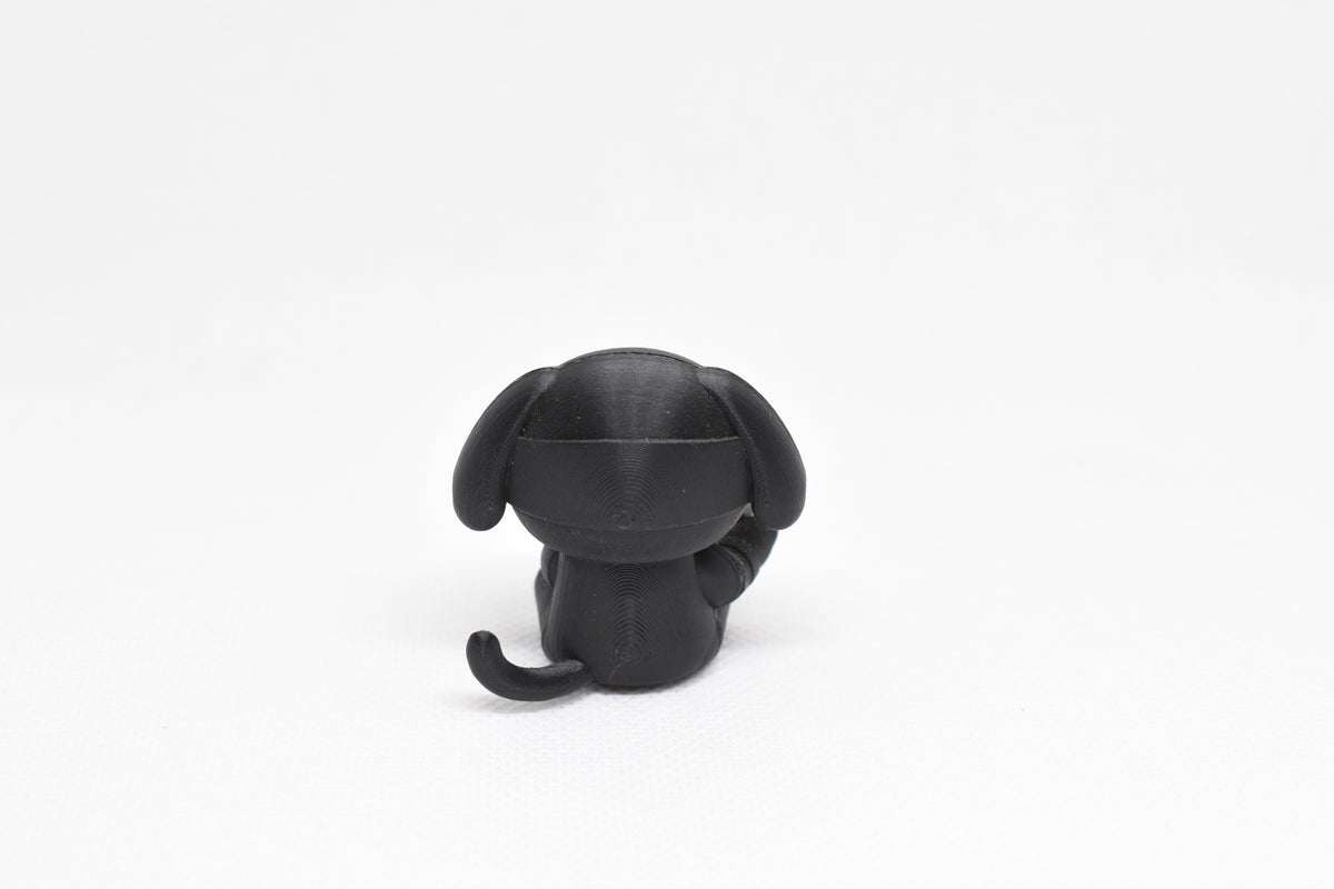 Rear view showing ninja cowl headband, floppy ears, and curved tail profile of black 3D printed monomoodz ninja glyphie collectible figure by LayerPlay