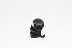 Side profile view showing floppy dog ears, raised tail, and white X eye detail of 3D printed monomoodz ninja glyphie desk figure by LayerPlay
