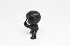 Side profile view showing tied headband knot and shuriken eye detail of 3D printed monomoodz shurikid desk figure by LayerPlay