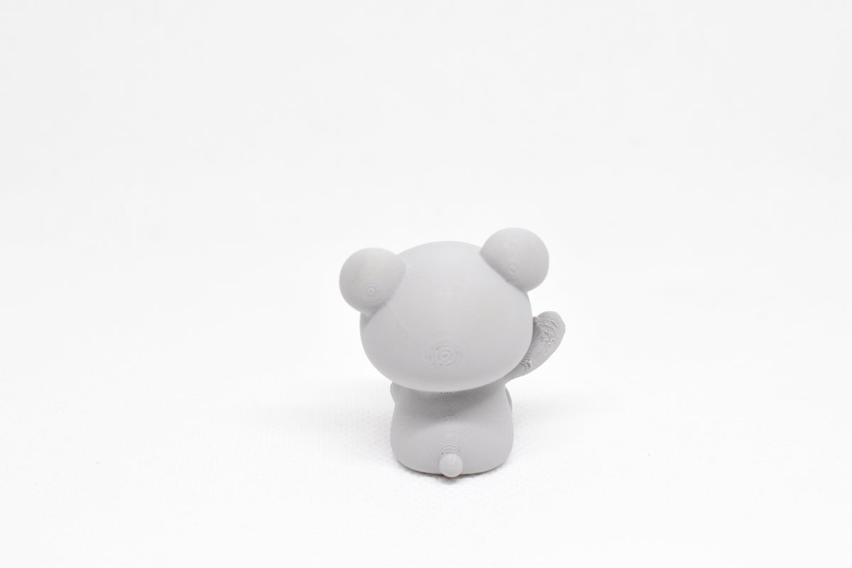 Rear view showing rounded bear ears and little tail of grey 3D printed monomoodz twinkle collectible figure by LayerPlay