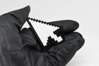 Hand in black glove holding 3D printed retro pixel arrow cursor keychain front view detail by LayerPlay