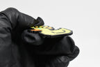 Side angle view showing 3D layered pixel detail and thickness of Ascended Duck pixel rubber duck keychain by LayerPlay