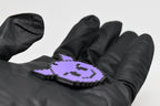 Side angle view showing 3D layered pixel detail and thickness of pixelated devil emoji keychain by LayerPlay