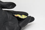 Side angle view showing 3D layered pixel detail and thickness of Lil Quack pixel rubber duck keychain by LayerPlay