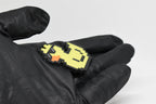 Side angle view showing 3D layered pixel detail and thickness of pixel rubber duck keychain by LayerPlay