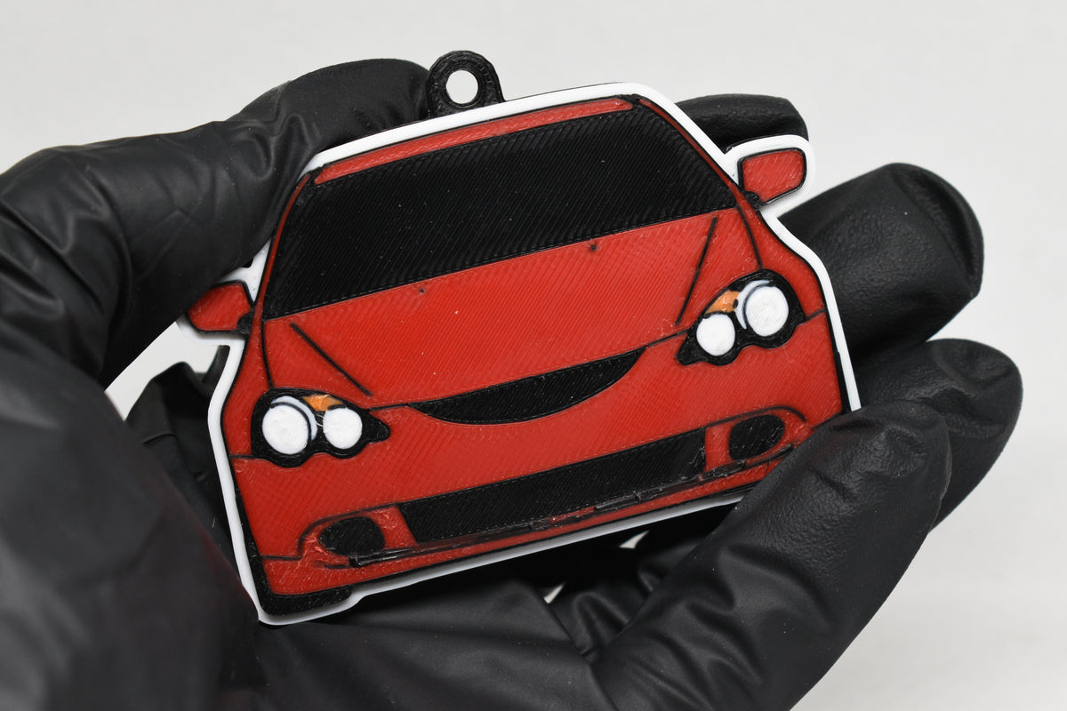 3D printed red Acura RSX DC5 keychain held in hand, front view detail by LayerPlay Pocket Motors