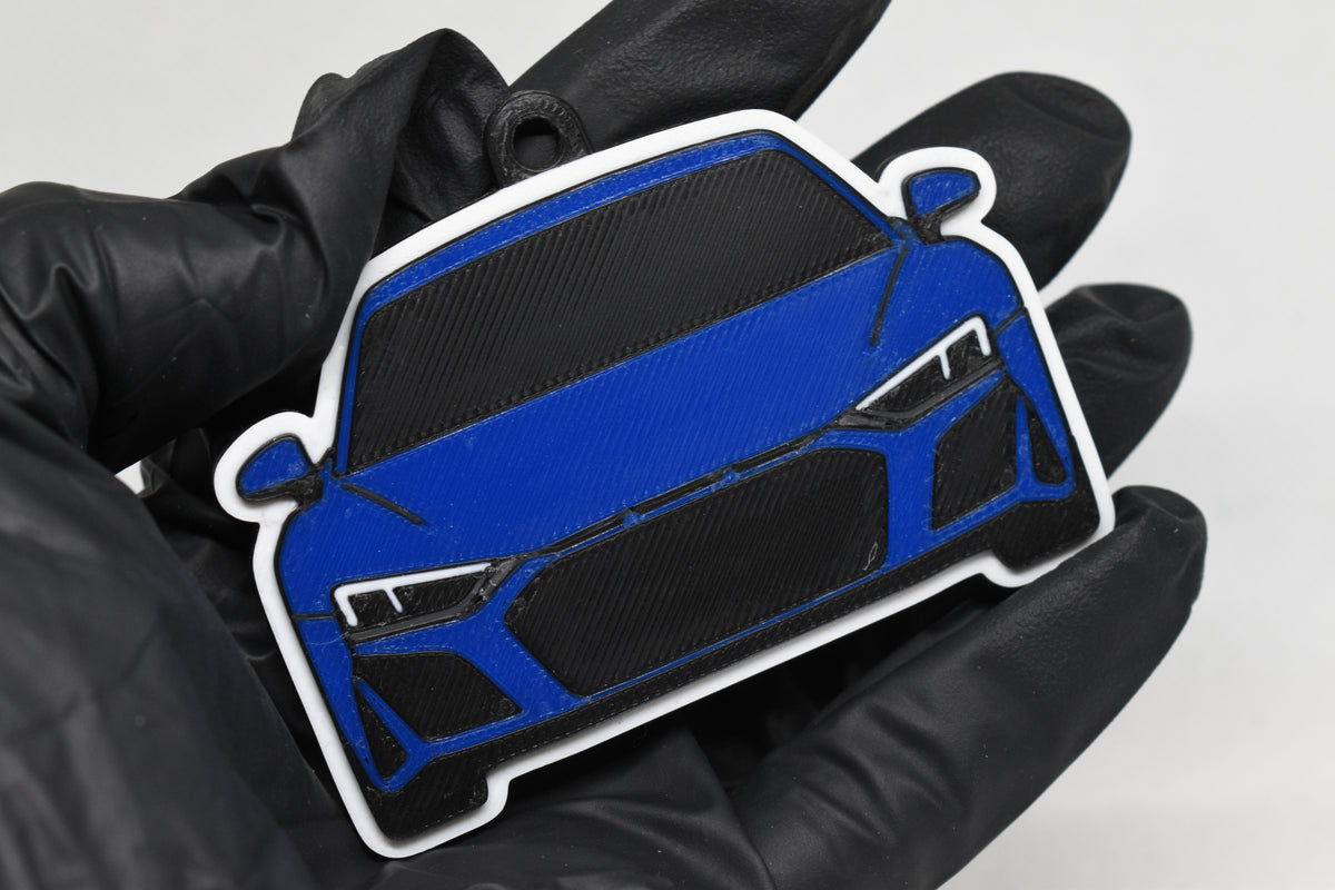 3D printed blue Audi R8 keychain held in hand, front view detail by LayerPlay Pocket Motors