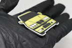 Side angle view showing 3D layered detail of yellow BMW M3 E36 keychain by LayerPlay Pocket Motors