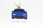 Pocket Motors Camaro SS 4th Gen keychain displayed on a white stand with metal ring and clip.