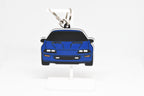 Pocket Motors Camaro Z28 4th Gen keychain displayed on a white stand with metal ring and clip.