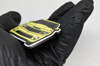 Side angle view showing 3D layered detail of yellow Chevrolet Camaro SS 5th Gen keychain by LayerPlay Pocket Motors