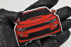 3D printed red Chevrolet Camaro SS 6th Gen facelift keychain held in hand, front view detail by LayerPlay Pocket Motors