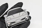 3D printed light gray Chevrolet Corvette C5 keychain held in hand, front view detail by LayerPlay Pocket Motors